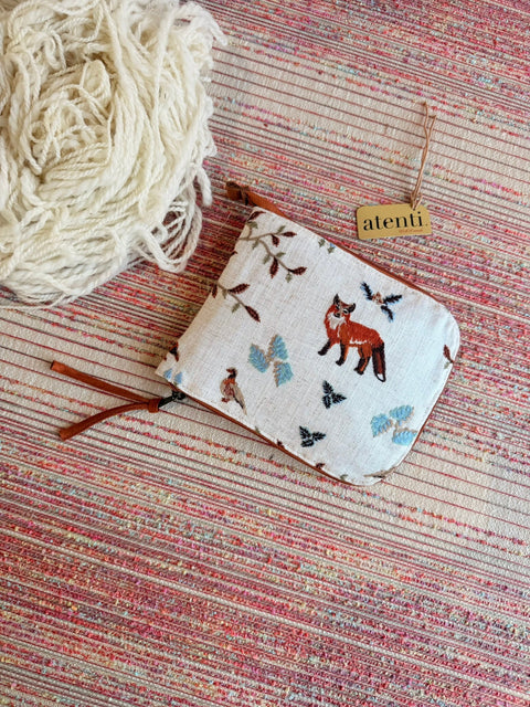 Atenti Foxy Circular Needle Case with woodland fox and branch motifs on pale fabric.
