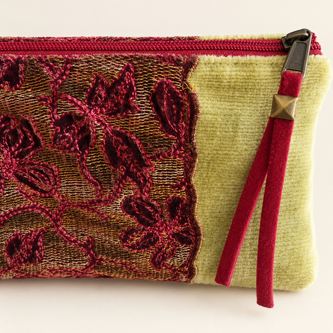 Close-up of burgundy floral lace, textured golden fabric and the red zipper on Atenti Golden Garland Tall Tool Pouch.