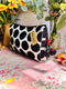Black and white polka dot velvet pouch with red tassels 