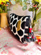 Black and white polka dot velvet pouch with red tassels 