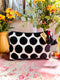 Black and white polka dot velvet pouch with red tassels 