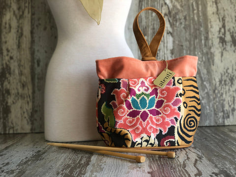 Atenti Le Tigre Tall Caddy with colorful floral and tiger motifs on dark fabric, coral top trim and a loop handle.