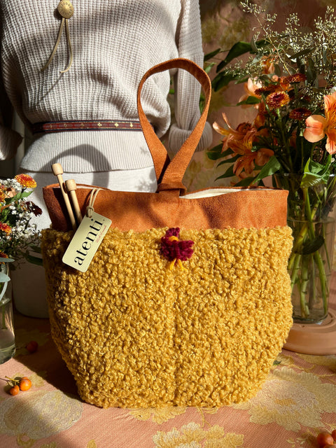 Atenti Yolk Tall Caddy with mustard faux sherpa texture with brown trim and handle.