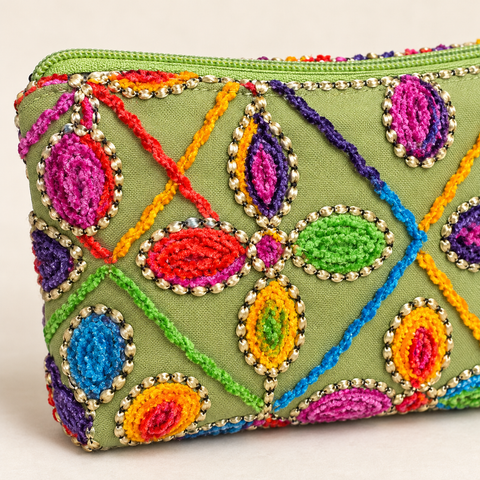 Close-up of colorful stitched floral shapes and textured embellishment on Atenti Confetti Garden Tall Tool Pouch.