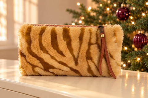 Atenti Caramel Tiger Tall Tool Pouch in golden brown tiger stripes beside a decorated Christmas tree.