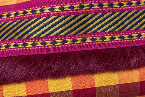 Atenti Cranberry Plaid Tall Tool Pouch detail showing striped ribbon, burgundy trim and red and gold checked fabric.