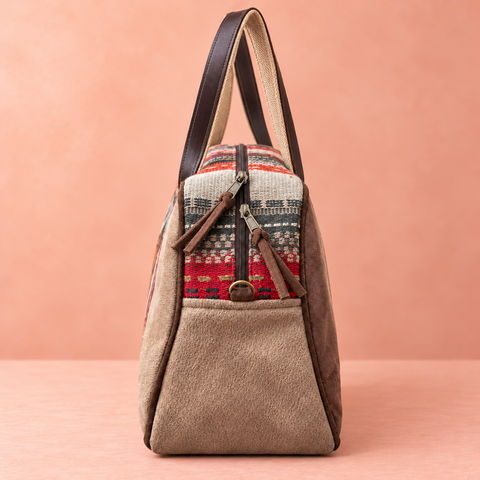 Tapestry Overnighter narrow end with woven bands, taupe lower panel and two zipper sliders