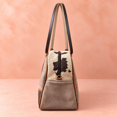 Bronco Overnighter narrow end with cream-and-brown woven top, taupe gusset and brass ring