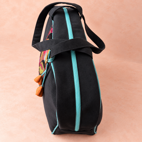 Lovebirds Overnighter top view with double black handles and turquoise zipper
