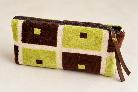 Angled view of Atenti Retro Evergreen Tall Tool Pouch, showing its green and brown square pattern and zipper pull.