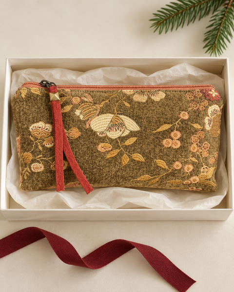 Atenti Woodland Bloom Tall Tool Pouch in a tissue-lined holiday gift box with burgundy ribbon and evergreen greenery.